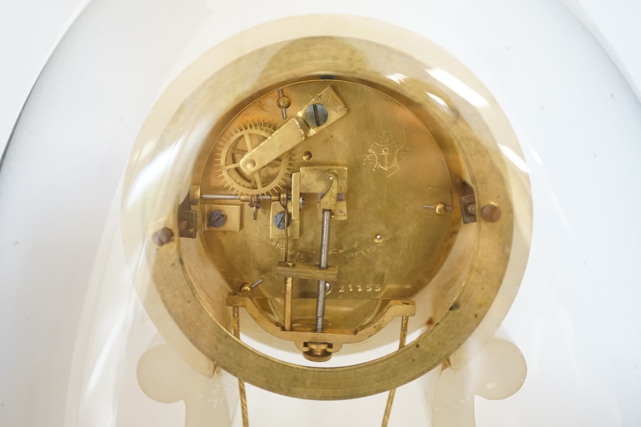A 19th century French alabaster mantel clock under dome, 32cm total. Condition - fair to good